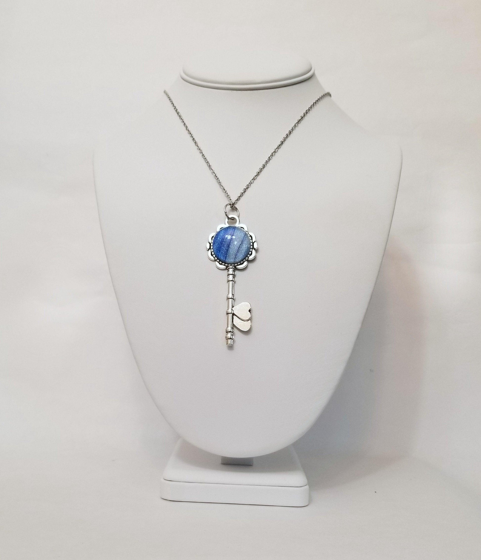 Silver finish Flowered Skeleton Key with Fused Glass Blue Stripe Dichroic cabochon on 24 inch stainless steel chain Seeds Glassworks  seedsglassworks jewelry