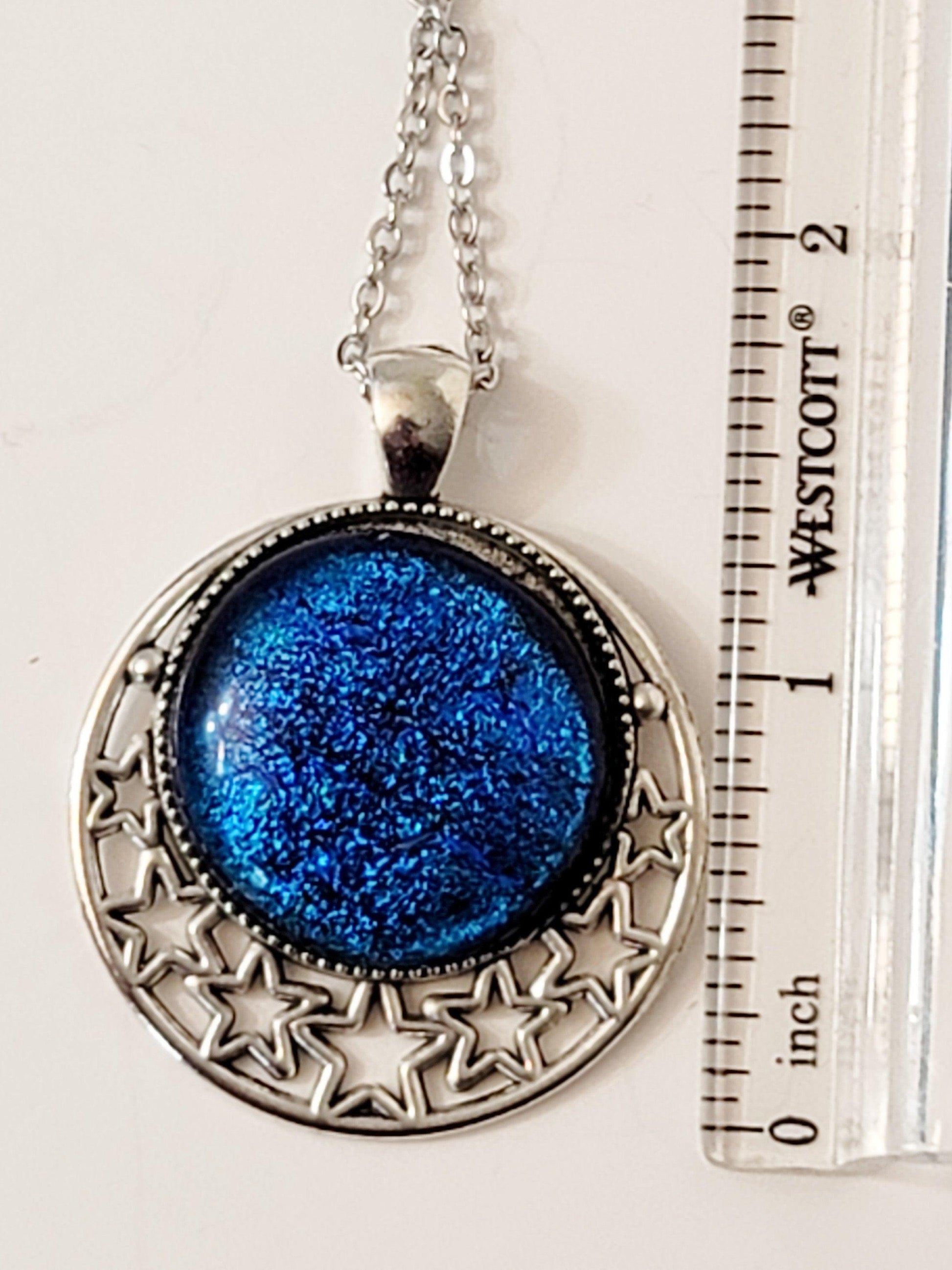 Silver tone Stars Pendant with Blue dichroic glass cabochon on a 20 inch steel metal chain. seeds glassworks fused glass jewelry