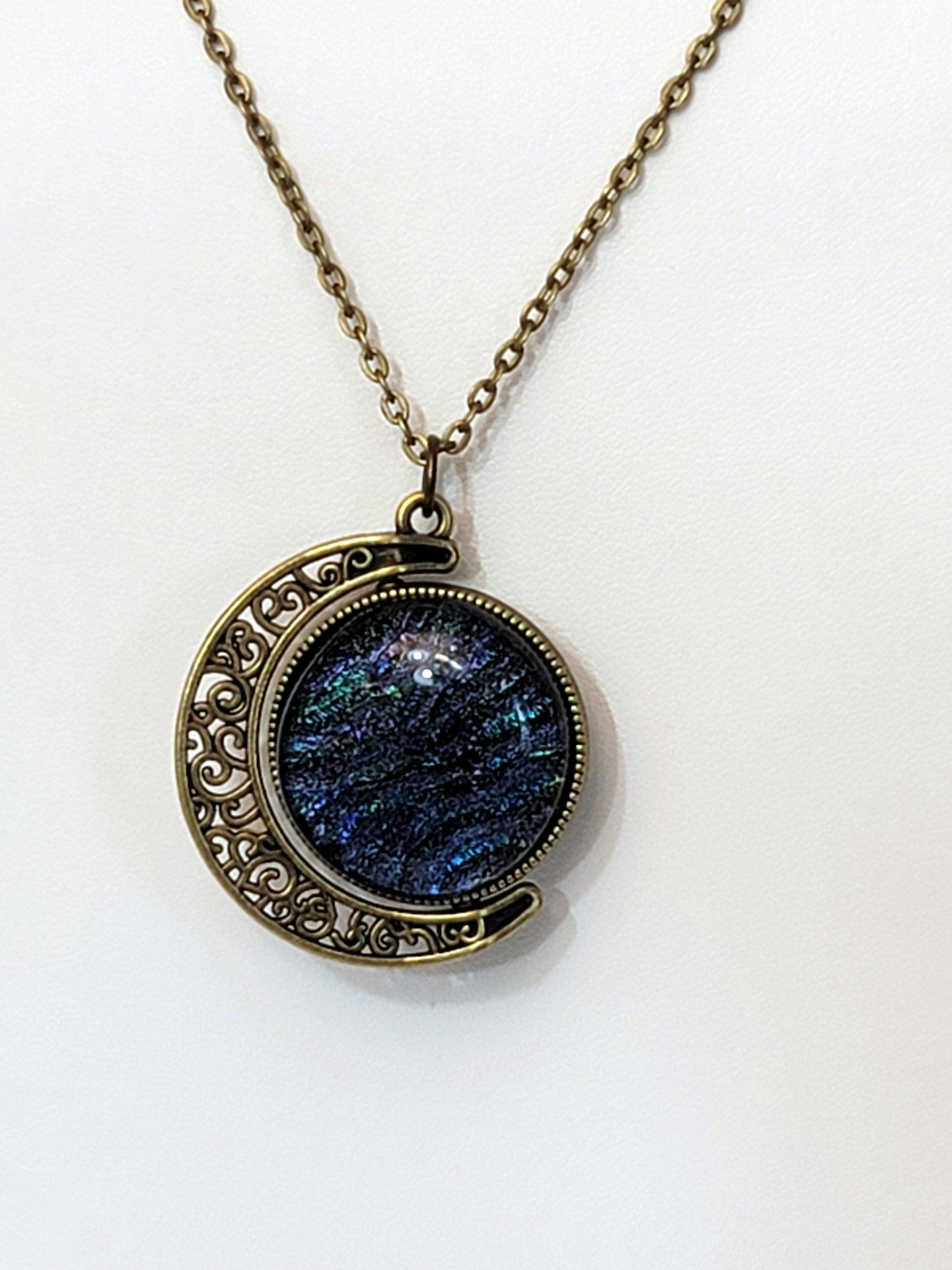 Blue and Green Dichroic Glass double sided Crescent Moon Pendant with Spinner antique bronze look on 20 inch chain. seeds glassworks, fused glass  seedsglassworks