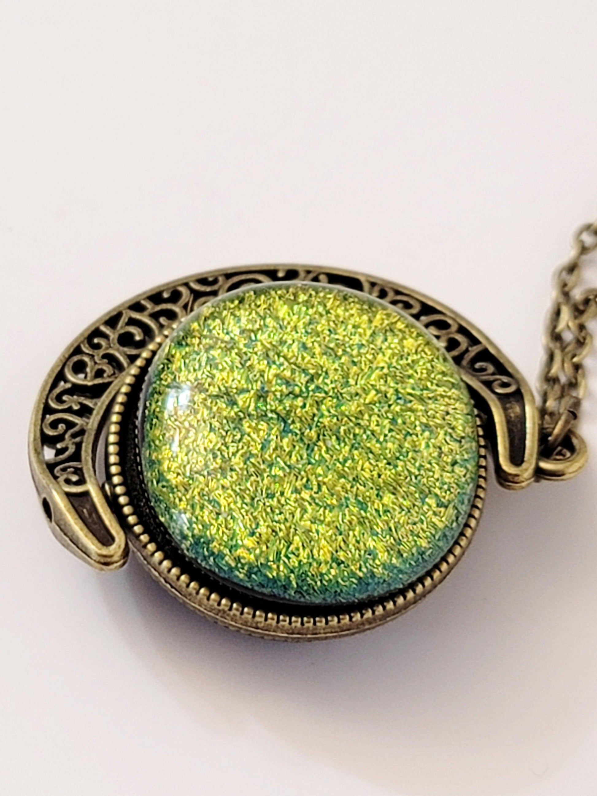 Blue and Green Dichroic Glass double sided Crescent Moon Pendant with Spinner antique bronze look on 20 inch chain. seeds glassworks, fused glass  seedsglassworks