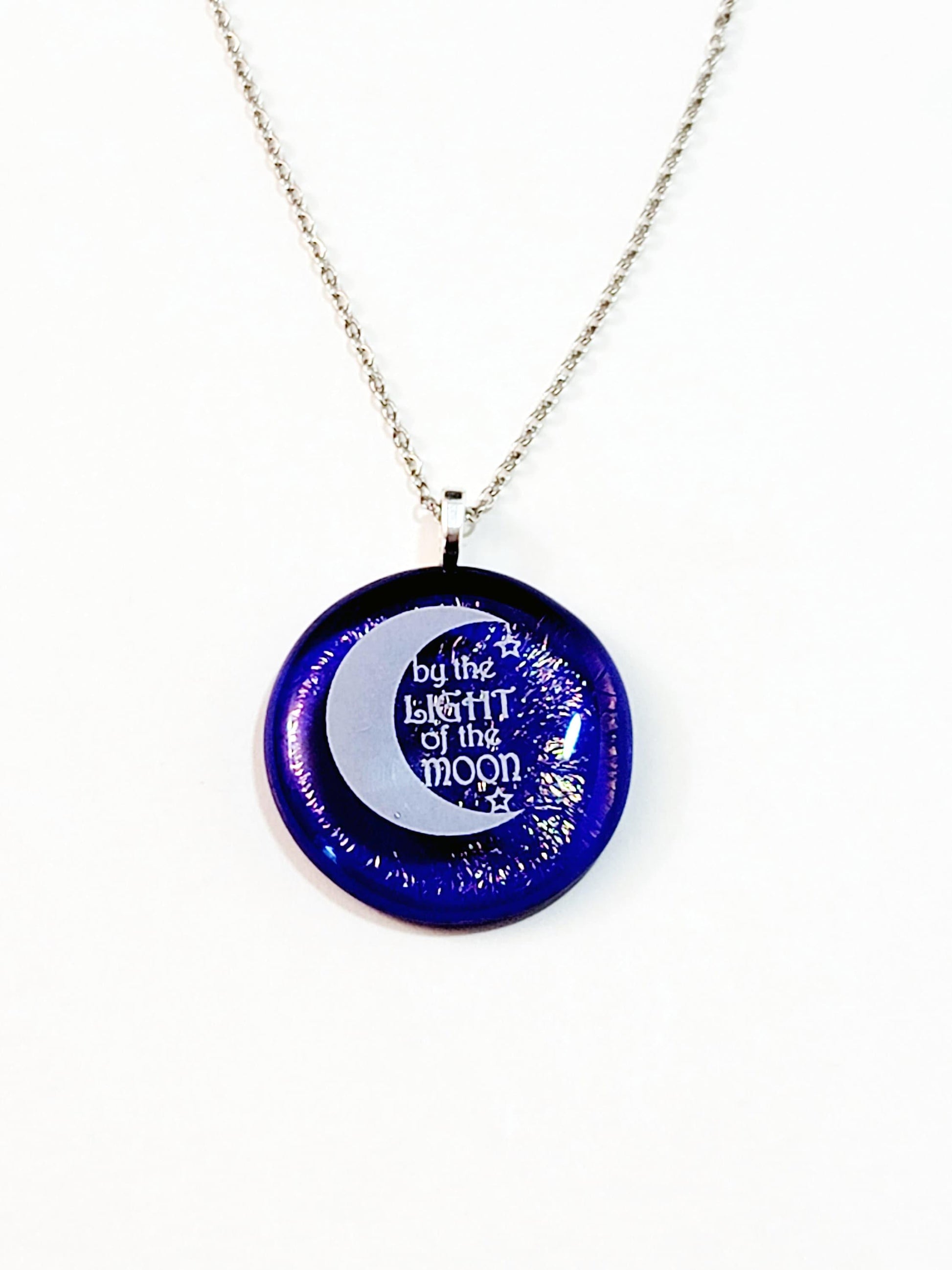 Crescent Moon, white on dark clear blue with crinkle effect fused glass circle pendant on 20 inch steel chain seeds glassworks seedsglassworks