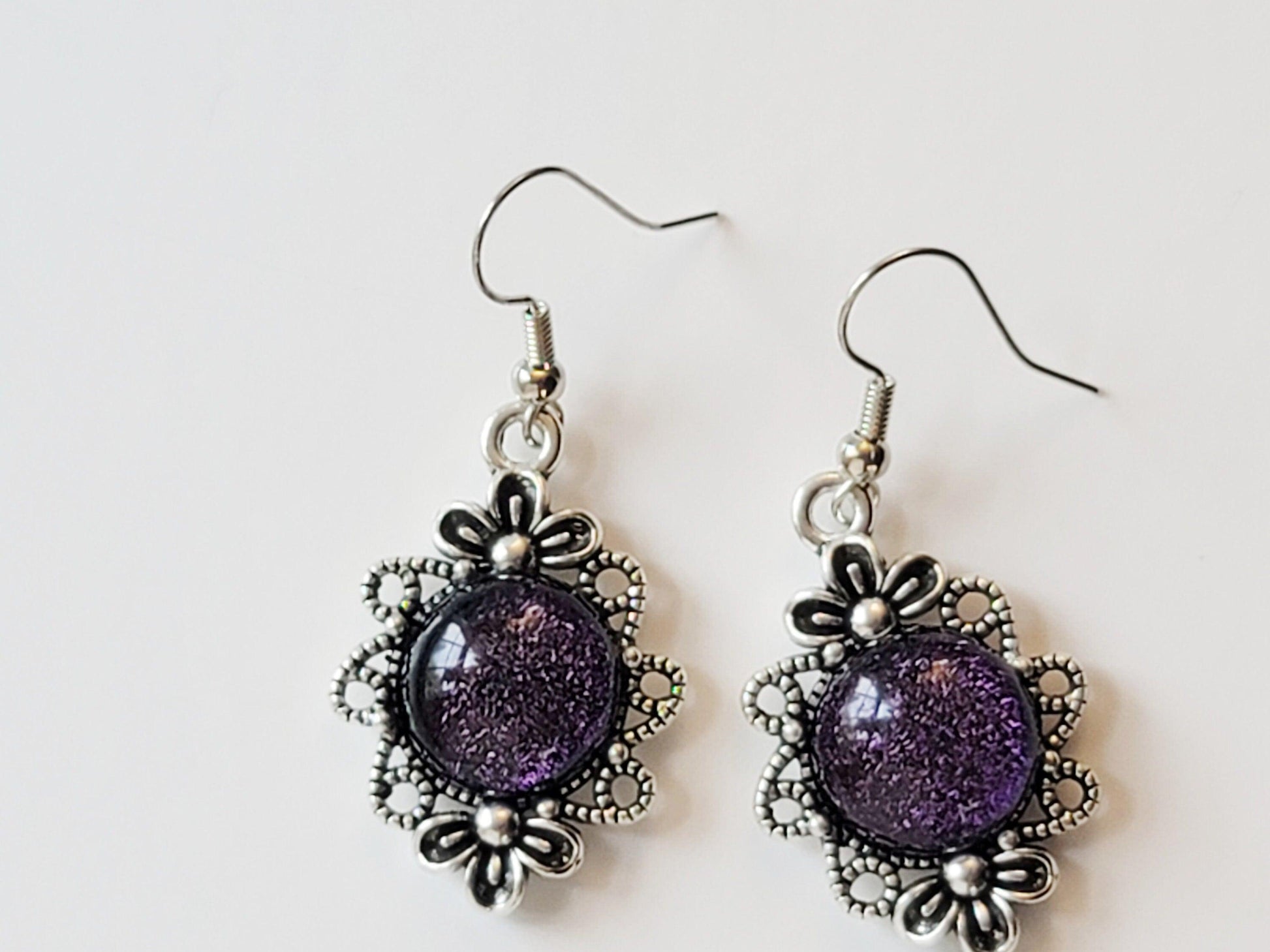 Silver tone flower earrings with color shifting purple dichroic fused glass cabo pierced seedsglassworks seeds glassworks