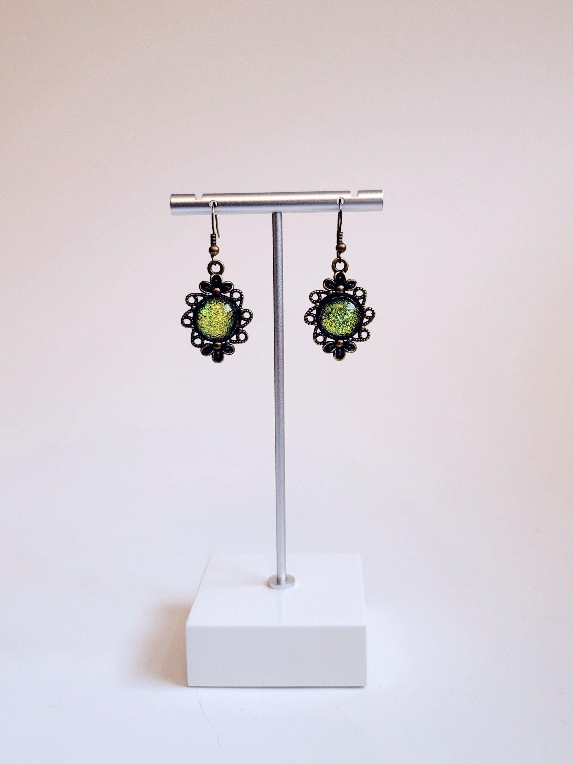 Brass flower earrings with color shifting green/yellow dichroic fused glass cabo pierced Seeds Glassworks seedsglassworks