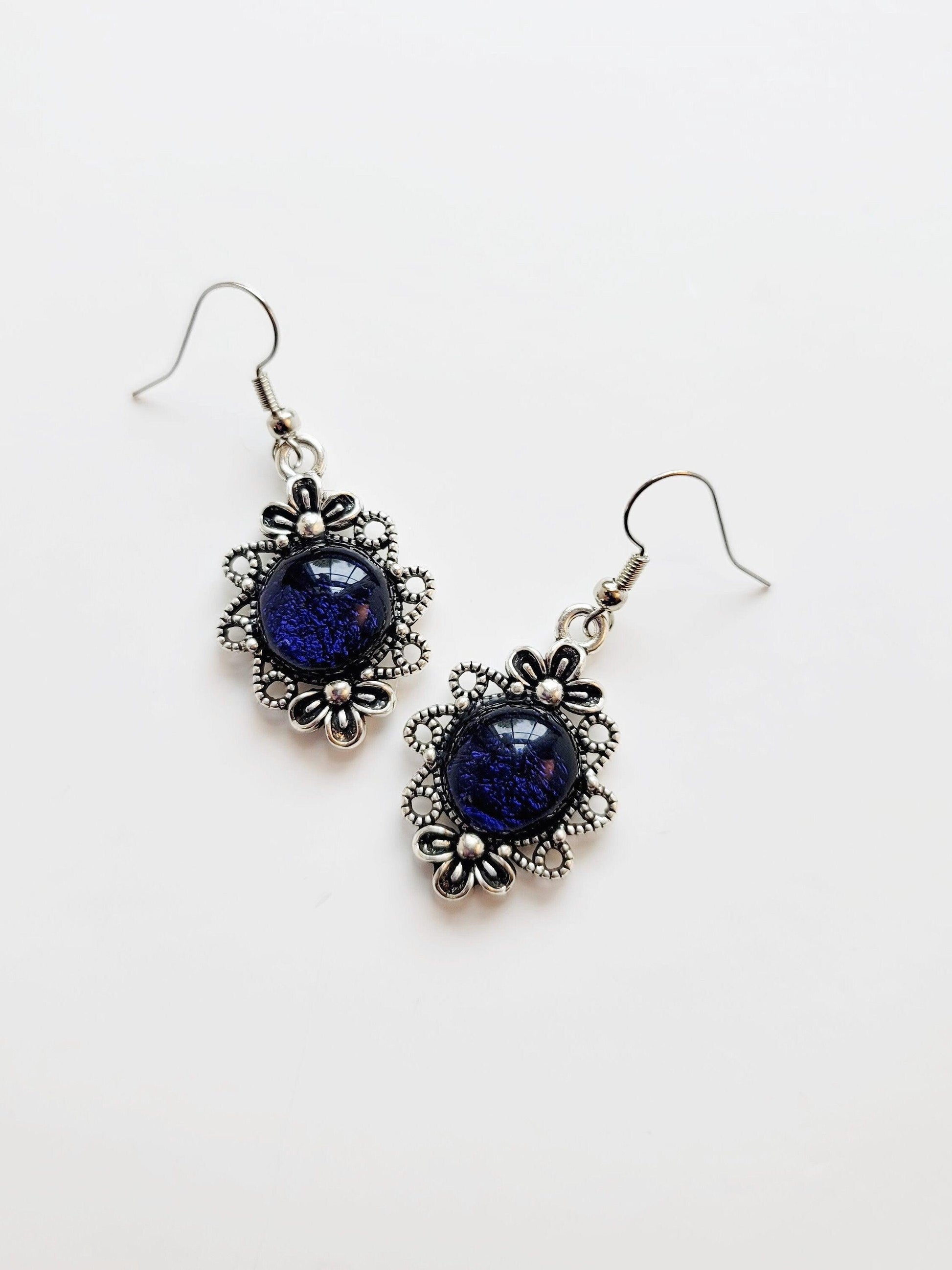 Silver tone flower earrings with dichroic dark blue fused glass cabo pierced style seedsglassworks seeds glassworks
