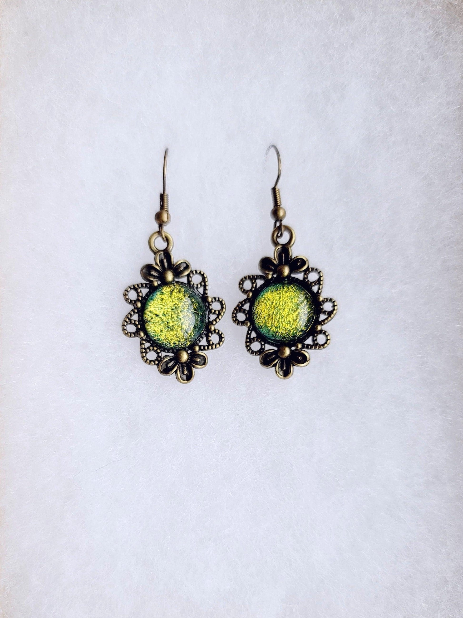 Brass flower earrings with color shifting green/yellow dichroic fused glass cabo pierced Seeds Glassworks seedsglassworks