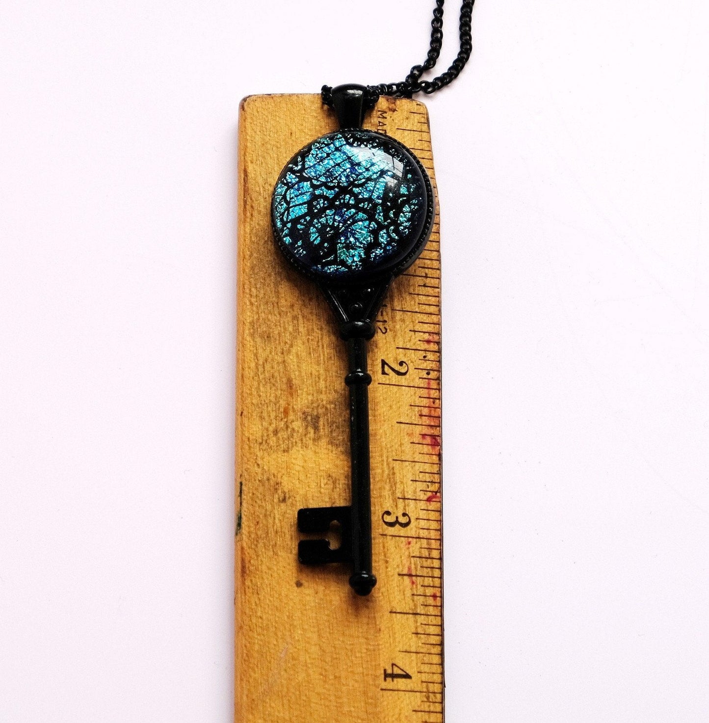 Products Black Metal Skeleton Key pendant necklace with Fused Glass Blue Lace cabochon on 24 inch black chain jewelry seeds glassworks seedsglassworks
