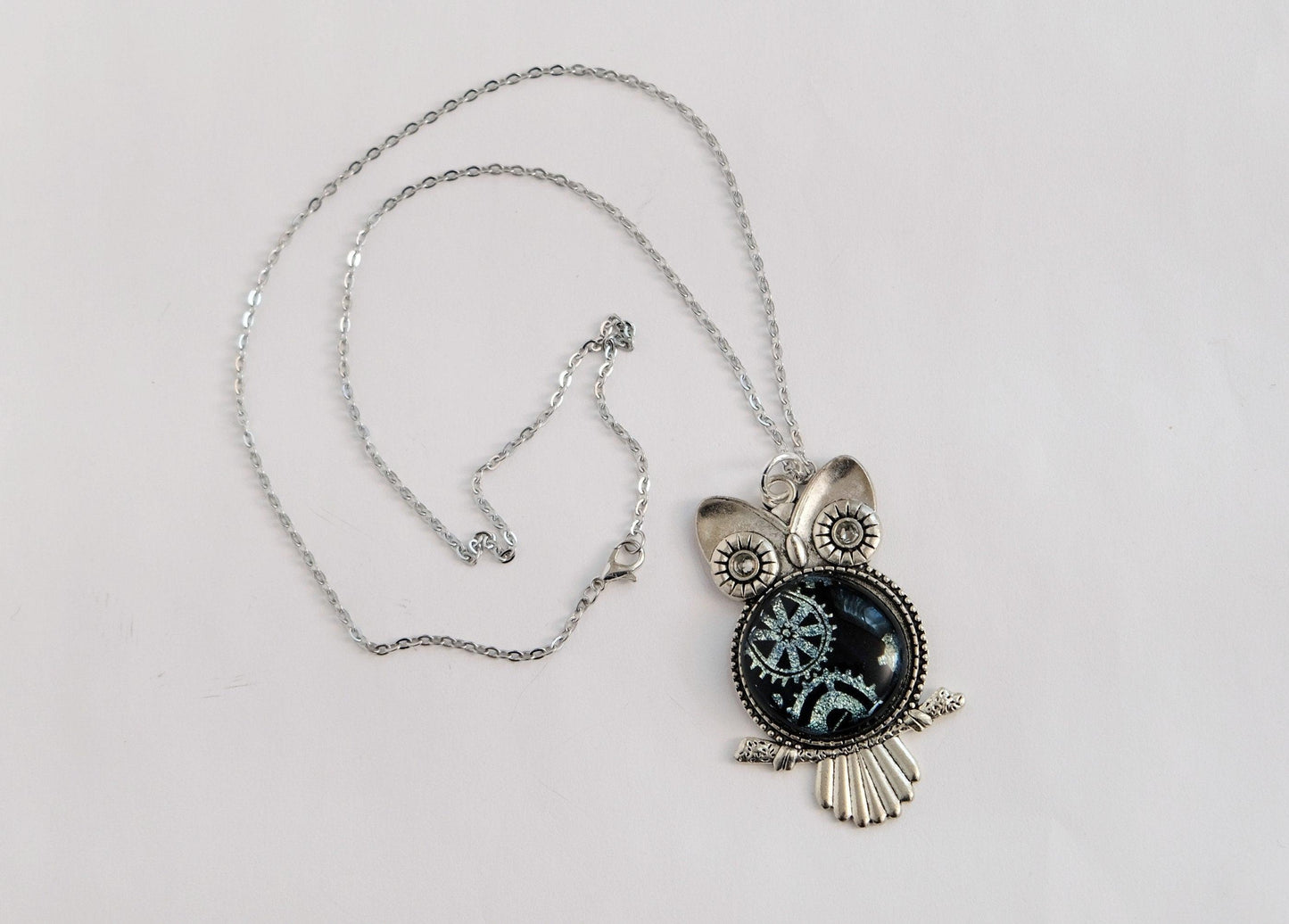 Steampunk Owl pendant necklace, silver tone  with silver gears on black dichroic fused glass center stone on an 20 inch steel chain seeds glassworks seedsglassworks
