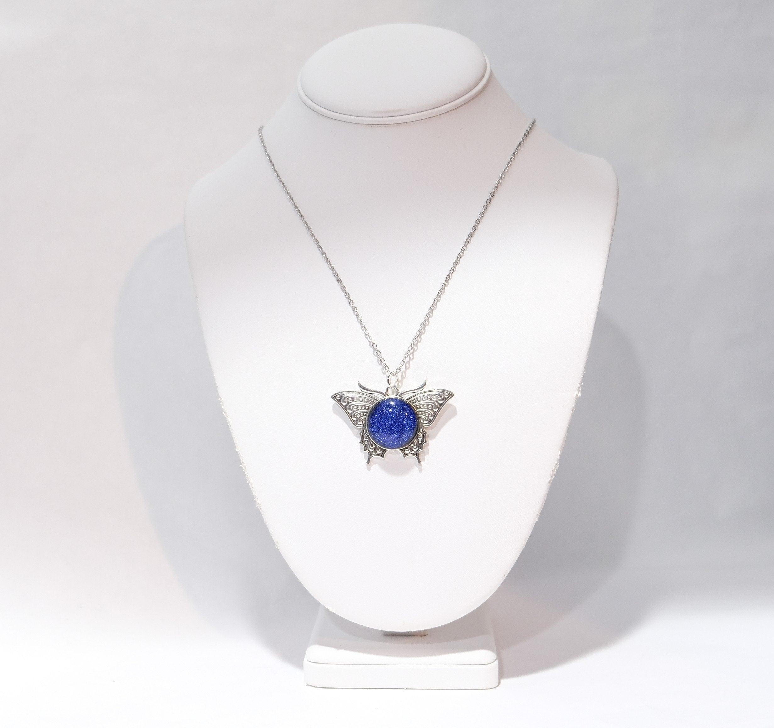Products Butterfly pendant necklace, silver tone with blue dichroic fused glass  center stone on a 20 inch steel chain seeds glassworks seedsglassworks