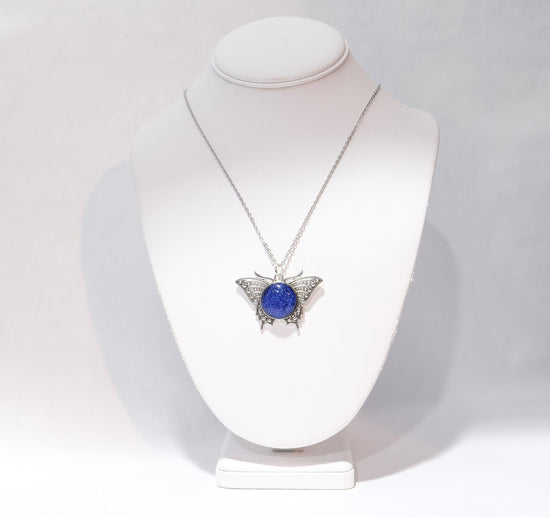 Products Butterfly pendant necklace, silver tone with blue dichroic fused glass  center stone on a 20 inch steel chain seeds glassworks seedsglassworks