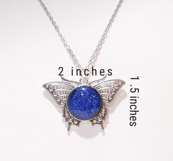 Products Butterfly pendant necklace, silver tone with blue dichroic fused glass  center stone on a 20 inch steel chain seeds glassworks seedsglassworks
