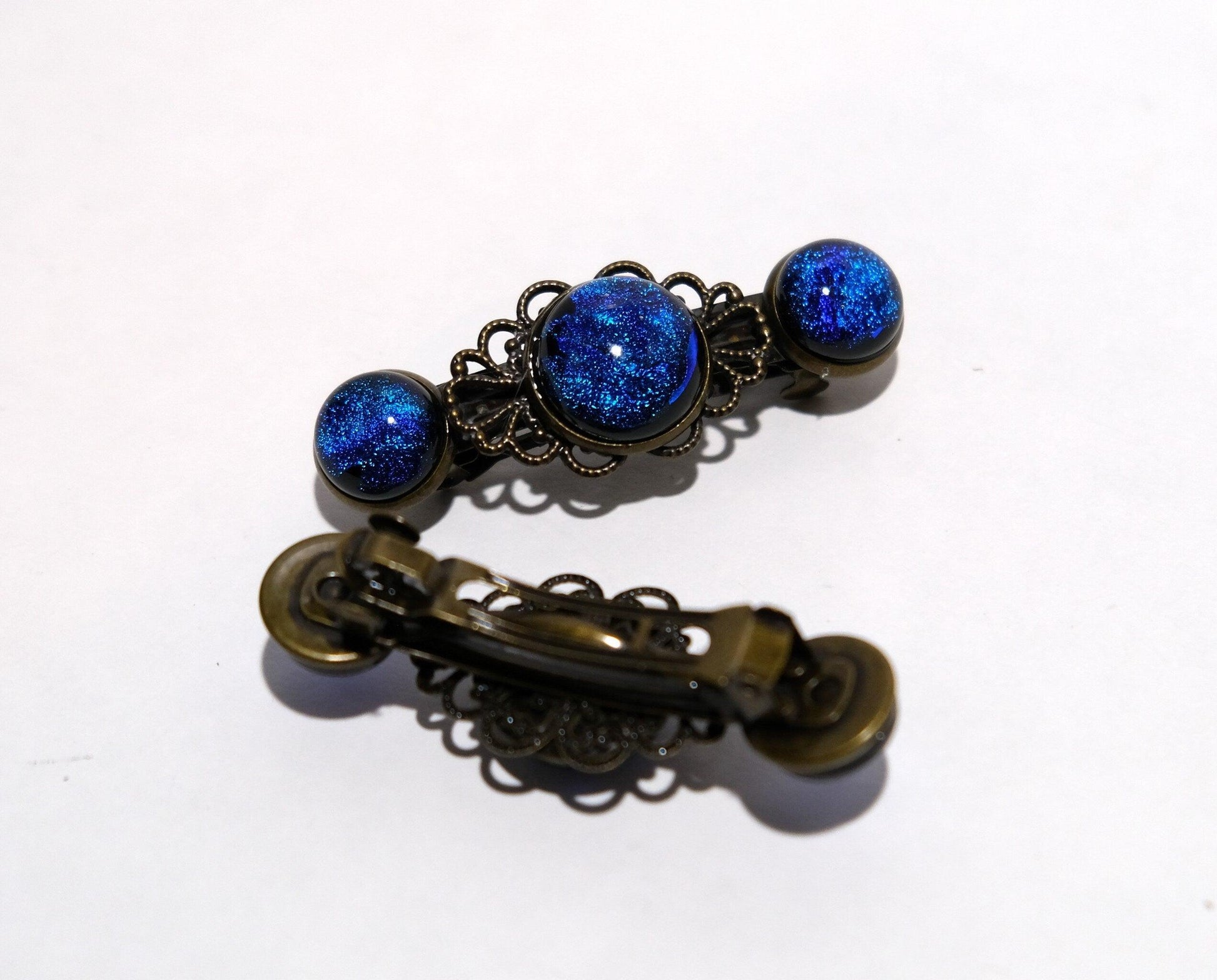 Barrette pair, bronze flowers with blue dichroic fused glass cabochons, french clip, 2 1/4 inches seedsglassworks seeds glassworks