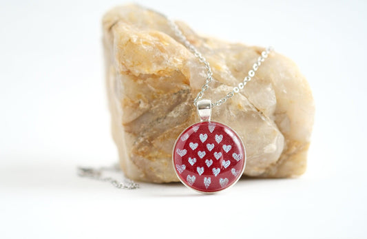 Silver tone pendant necklace with Fused Glass Red with dichroic hearts pattern cabochon on 24 inch steel chain jewelry seeds glassworks seedsglassworks