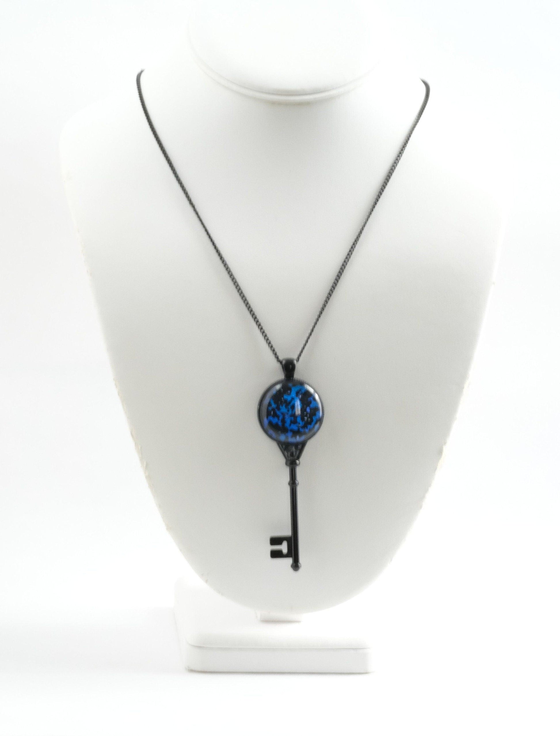 Black Metal Skeleton Key pendant necklace with Fused Glass Blue and Black  cabochon on 24 inch black chain jewelry seeds glassworks seedsglassworks