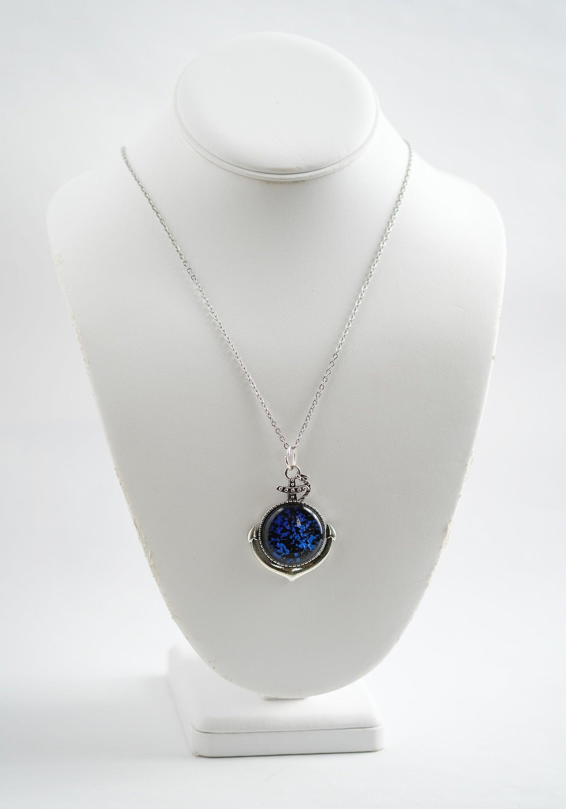 Silver Anchor pendant necklace, with blue and black sparkling dichroic fused glass center stone on a 20 inch steel chain seeds glassworks seedsglassworks