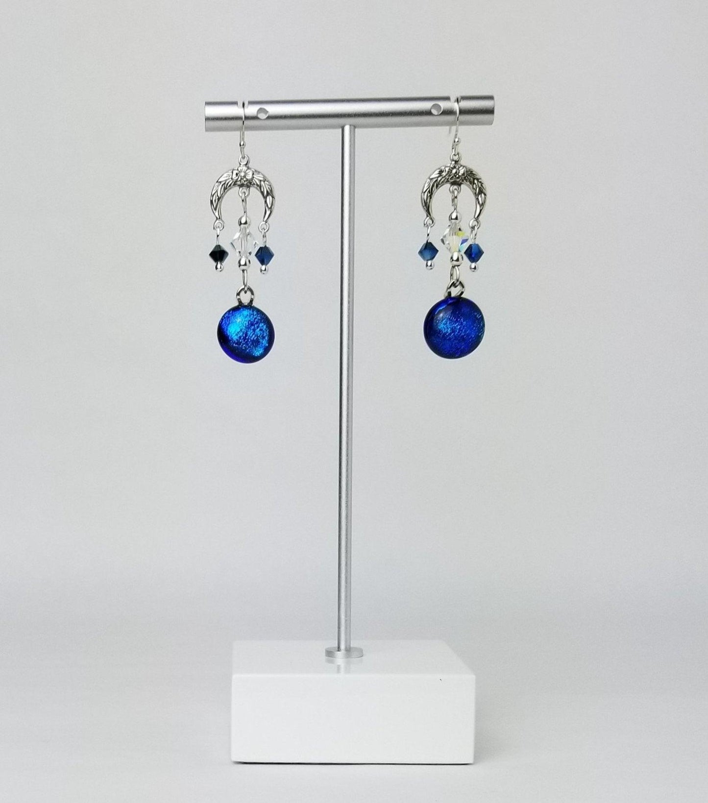 Blue Floral Crescent pireced earrings. Blue dichroic fused glass with Swarovski crystals & sterling silver by Seeds Glassworks, Seedsglassworks